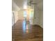Spacious bonus room featuring hardwood floors, natural light, and multiple closet spaces at 2631 Mcleay Dr, Indianapolis, IN 46220