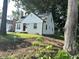 A view of the side and front of the home with a grassy lawn at 2631 Mcleay Dr, Indianapolis, IN 46220