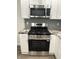 A kitchen with stainless steel appliances and grey subway tile backsplash at 2631 Mcleay Dr, Indianapolis, IN 46220