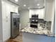 Modern kitchen with stainless steel appliances and granite countertops at 2631 Mcleay Dr, Indianapolis, IN 46220