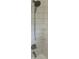 A shower featuring a handheld shower head, sleek subway tile, and convenient corner shelves at 2631 Mcleay Dr, Indianapolis, IN 46220