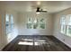Sun-filled room with wood-look floors and plenty of windows at 2631 Mcleay Dr, Indianapolis, IN 46220