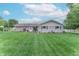 Large backyard featuring well-maintained lawn and established landscaping at 2875 E Woodside Dr, Mooresville, IN 46158