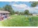 Large backyard featuring a playset, patio area with furniture, and a storage shed for outdoor equipment at 2875 E Woodside Dr, Mooresville, IN 46158