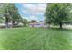 Wide-open backyard featuring large shade trees and established landscaping at 2875 E Woodside Dr, Mooresville, IN 46158