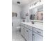 Bright bathroom features white vanity with storage and hexagonal tile floor at 2875 E Woodside Dr, Mooresville, IN 46158
