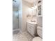 Bright bathroom with a walk-in shower and a vanity with a white marble countertop at 2875 E Woodside Dr, Mooresville, IN 46158