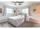 Comfortable bedroom with a ceiling fan and bright, natural light coming in from two windows at 2875 E Woodside Dr, Mooresville, IN 46158