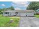 Charming home featuring a two-car garage, large yard, and meticulous landscaping at 2875 E Woodside Dr, Mooresville, IN 46158