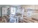 Open kitchen with modern appliances, a dining area, and a sliding glass door to the backyard at 2875 E Woodside Dr, Mooresville, IN 46158