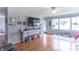 Bright living room with hardwood floors, large windows, and a cozy atmosphere for relaxation and entertainment at 2875 E Woodside Dr, Mooresville, IN 46158