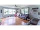 Comfortable living room with hardwood floors, large windows, and a plush sofa for relaxation and entertainment at 2875 E Woodside Dr, Mooresville, IN 46158