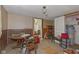 A cluttered basement space with a table, chairs, shelving, and access to utilities at 31 Brooklyn Ct, Mooresville, IN 46158