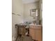 Small bathroom featuring a sink, mirror, toilet, and limited counter space at 31 Brooklyn Ct, Mooresville, IN 46158