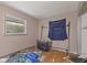 Bedroom featuring a window, hardwood floors, personal items, and closet at 31 Brooklyn Ct, Mooresville, IN 46158