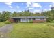 Charming single-story home with a brick base, light blue siding, and a spacious front yard at 31 Brooklyn Ct, Mooresville, IN 46158