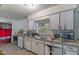 Functional kitchen with ample counter space, cabinets, and a convenient layout ready for your updates at 31 Brooklyn Ct, Mooresville, IN 46158