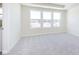 Bright bedroom featuring plush carpet and three large windows for ample natural light at 3307 Noriker Ln, Zionsville, IN 46077