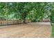Expansive backyard with new wooden fence and mature trees for privacy at 360 Richie Ave, Indianapolis, IN 46234
