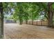 Large backyard with new wooden fence and lots of mature trees at 360 Richie Ave, Indianapolis, IN 46234