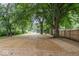 Spacious backyard, newly seeded, featuring new wooden fence and mature trees at 360 Richie Ave, Indianapolis, IN 46234