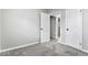 Cozy bedroom with neutral carpet and doors leading to another room at 360 Richie Ave, Indianapolis, IN 46234