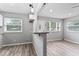 Bright kitchen featuring granite counters, a breakfast bar, and hardwood floors at 360 Richie Ave, Indianapolis, IN 46234