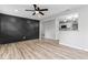 Modern living room showcasing hardwood floors, a unique accent wall, and an open floor plan at 360 Richie Ave, Indianapolis, IN 46234