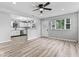 Inviting living room featuring hardwood floors, an open floor plan, and seamless access to the kitchen at 360 Richie Ave, Indianapolis, IN 46234