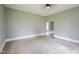 Neutral bedroom offers comfortable carpeting, soft paint, and ample natural light at 410 Plum St, Frankton, IN 46044