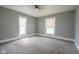 Bright and airy bedroom featuring carpeted floors, neutral paint, and large windows at 410 Plum St, Frankton, IN 46044