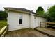 Side view of the home's exterior highlighting the window and deck at 410 Plum St, Frankton, IN 46044