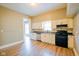 Beautiful kitchen with white cabinets, updated appliances, and modern flooring at 410 Plum St, Frankton, IN 46044