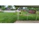 Lush backyard featuring a well-maintained lawn, storage shed, and garden at 420 Brookside Ln, Plainfield, IN 46168