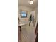 Classic bathroom with tiled floor, tub/shower combo, and window for natural light at 420 Brookside Ln, Plainfield, IN 46168