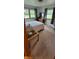 Bright bedroom featuring hardwood floors, neutral decor, and plenty of natural light at 420 Brookside Ln, Plainfield, IN 46168