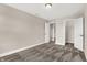 Neutral bedroom featuring plush carpet and access to closet and additional rooms at 425 Weaver Ln, Pittsboro, IN 46167