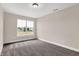 Neutral bedroom featuring large window and plush carpet at 425 Weaver Ln, Pittsboro, IN 46167