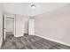 Neutral bedroom featuring plush carpet and access to closet and additional rooms at 425 Weaver Ln, Pittsboro, IN 46167