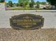 Elegant sign for Meadowbrook Manor Condominiums set against a lush green landscape at 4329 Rutgers Dr # 40B, Anderson, IN 46013
