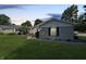 A well-manicured lawn surrounds a charming home with a brick facade at 4329 Rutgers Dr # 40B, Anderson, IN 46013