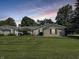 A well-maintained home features a large, verdant lawn and mature trees at 4329 Rutgers Dr # 40B, Anderson, IN 46013