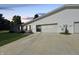 Home's wide driveway and garage are seen in this photo of the white, single-Gathering home at 4329 Rutgers Dr # 40B, Anderson, IN 46013