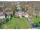 Aerial view of a beautiful brick home with well-manicured lawn and landscaping at 44 Horseshoe Ln, Carmel, IN 46033