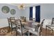 Stylish dining room with modern chandelier, decor and ample seating for elegant meals and gatherings at 44 Horseshoe Ln, Carmel, IN 46033