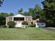 Charming two-story brick home with a well-manicured lawn, attached garage and inviting front entrance at 44 Horseshoe Ln, Carmel, IN 46033