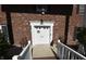 Inviting front entrance showcasing a bright white door with decorative accents and a brick facade at 44 Horseshoe Ln, Carmel, IN 46033