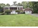 Charming two-story brick home featuring a landscaped front yard and attached garage at 44 Horseshoe Ln, Carmel, IN 46033