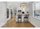 Bright kitchen area with an island, bar seating and stainless appliances for modern living at 44 Horseshoe Ln, Carmel, IN 46033