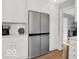 Kitchen area with a stainless steel refrigerator and white cabinets at 44 Horseshoe Ln, Carmel, IN 46033
